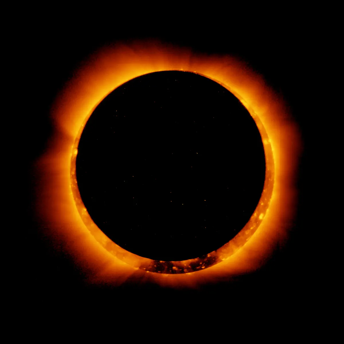 A glowing orange ring of the Sun's outer atmosphere around the black disc of the Moon, in X-ray light