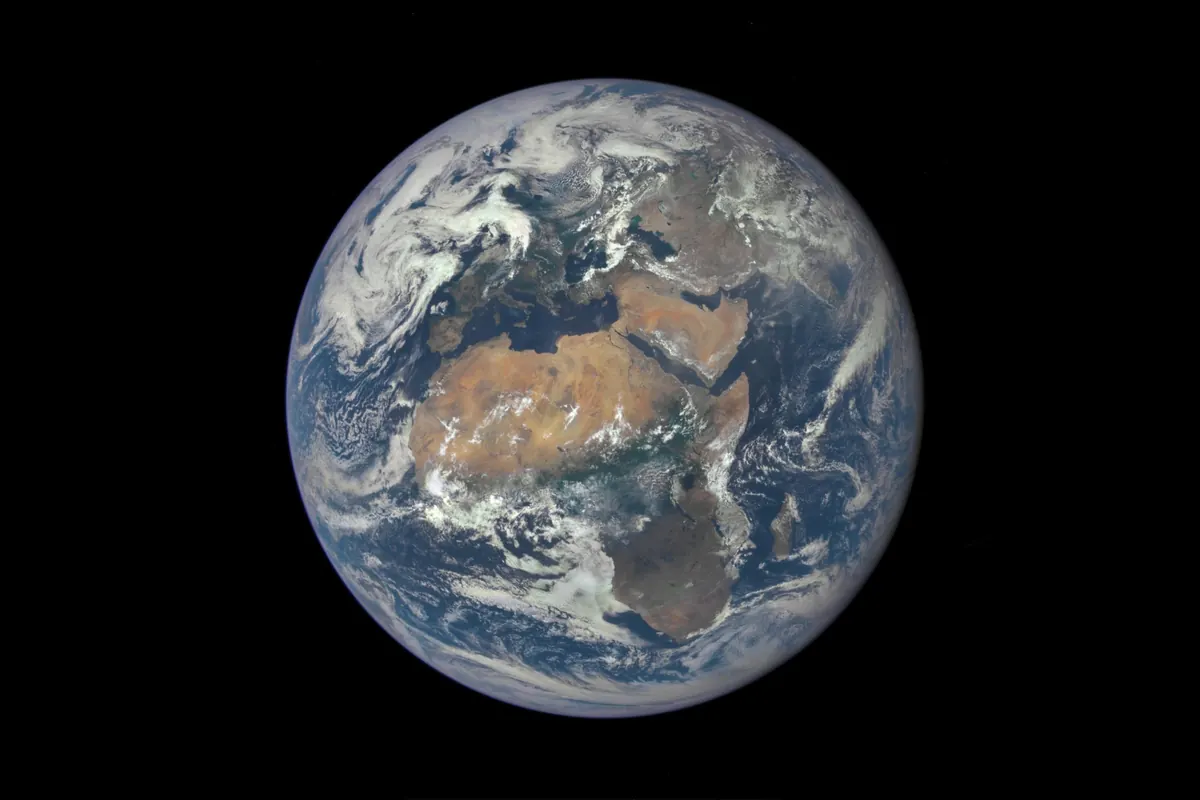 Earth as a blue and white disk with Africa at the center