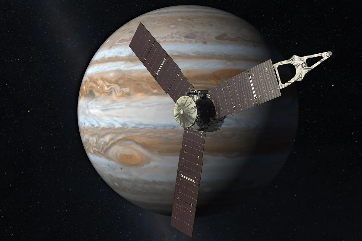 An illustration of the Juno spacecraft with three large solar panels in front of Jupiter