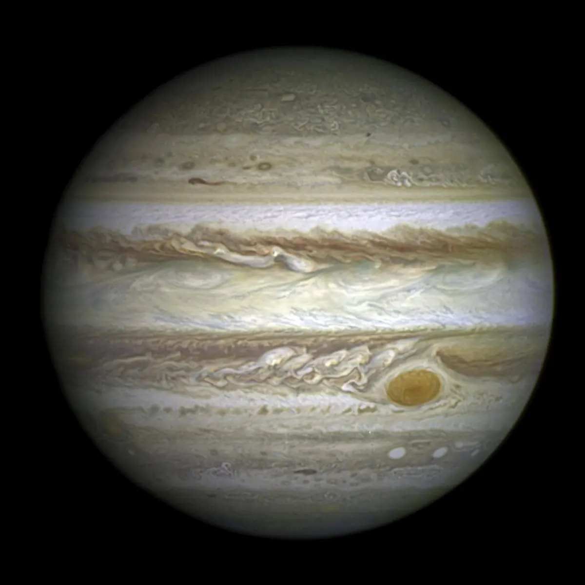 Jupiter's cloud bands in cream, tan and red with the Great Red Spot at lower right
