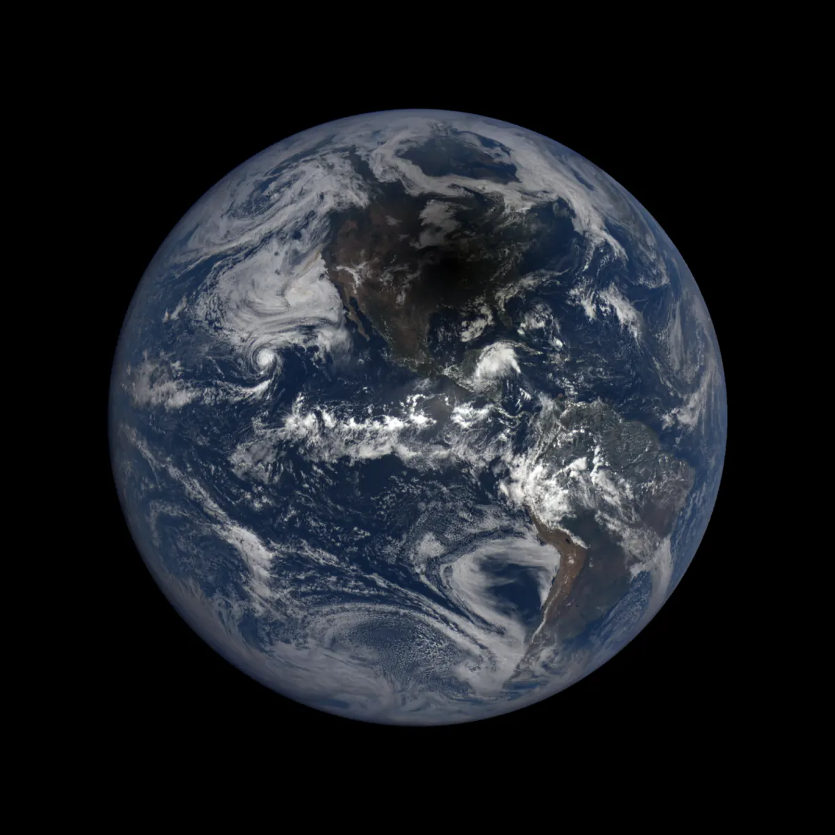 Earth seen from space with a dark oval shadow of the Moon over North America