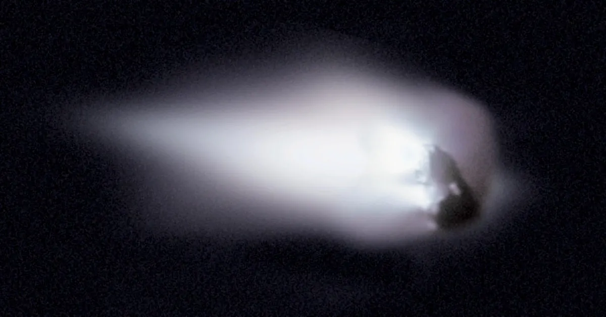 The dark, lumpy nucleus of Halley's Comet with bright jets of gas and dust streaming from it